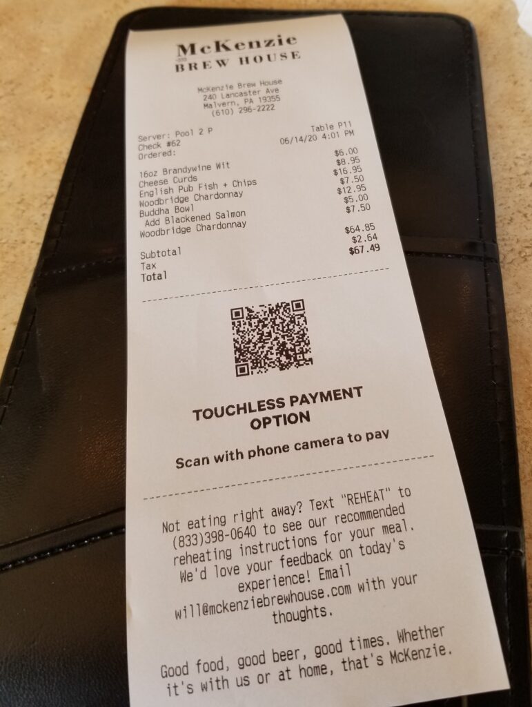 Example of a QR code call-to-action on a restaurant receipt that allows customers to pay with their phones instead of with a card