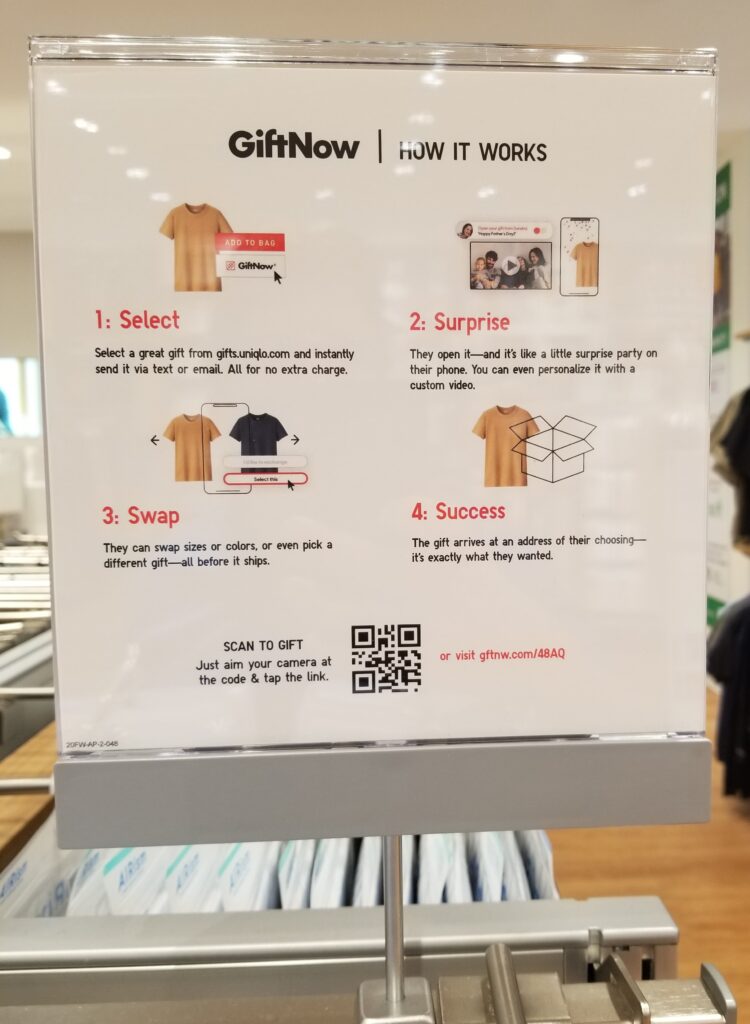 Example of a QR code call-to-action in a retail clothing store that helps customers find and send gifts to loved ones